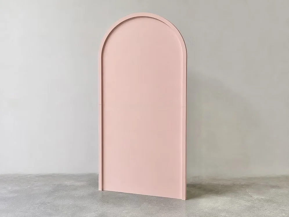 A pink 2D Framed event Arch Backdrop. Featuring a subtle raised border