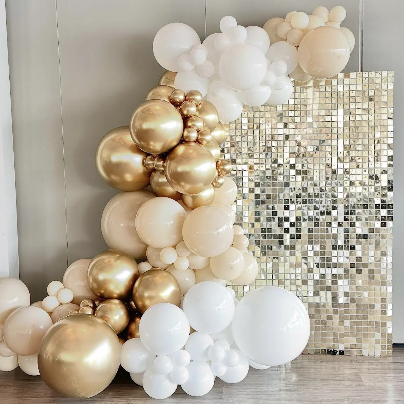 Gold party backdrop and balloons