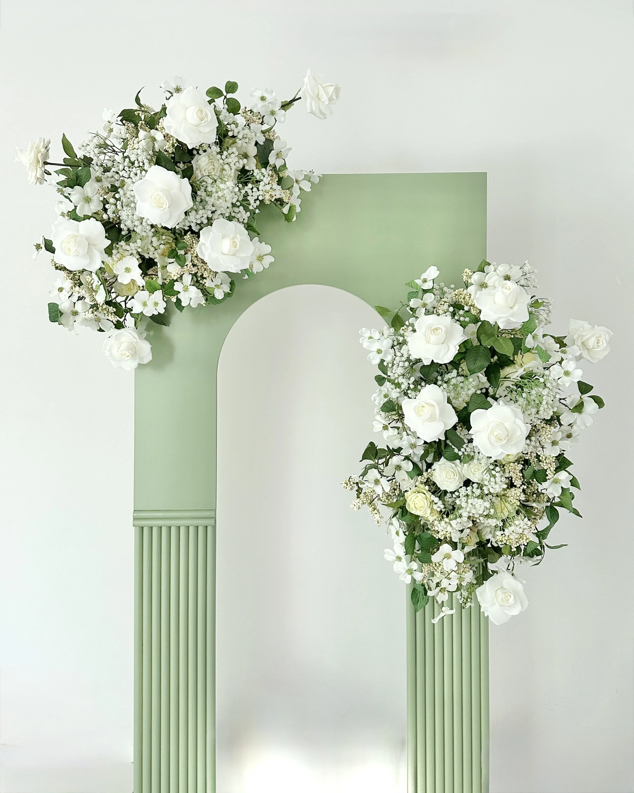 Flower hire package using our arch backdrop adorned with white roses and  baby's breath backdrop flowers