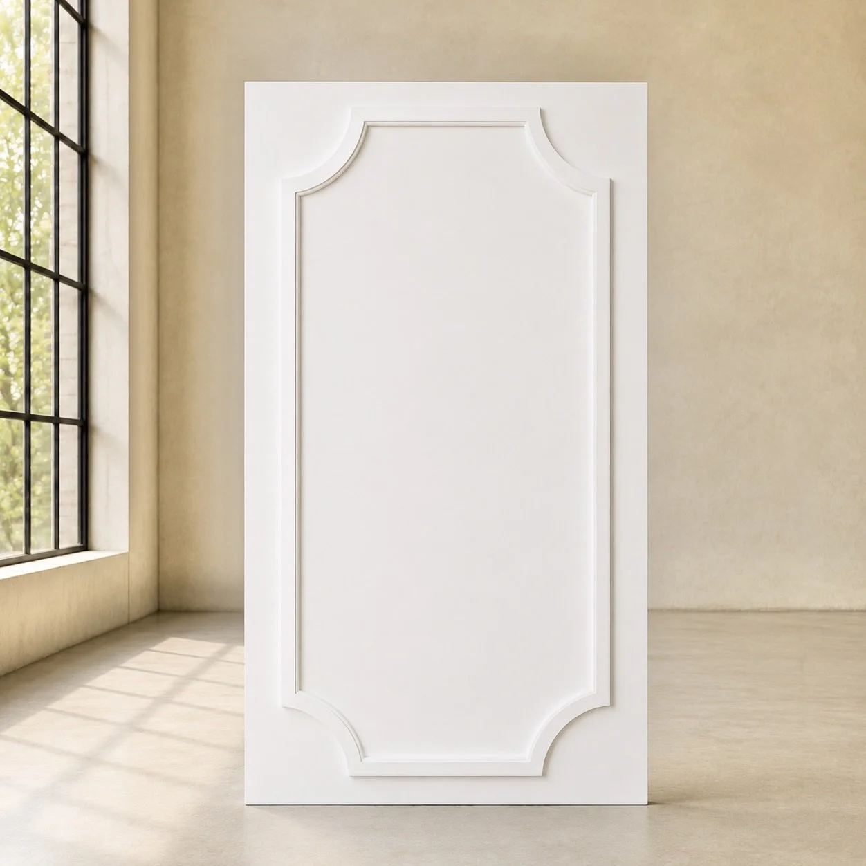 White decorative door with ornate trim, standing in a bright room with beige walls and a large window.