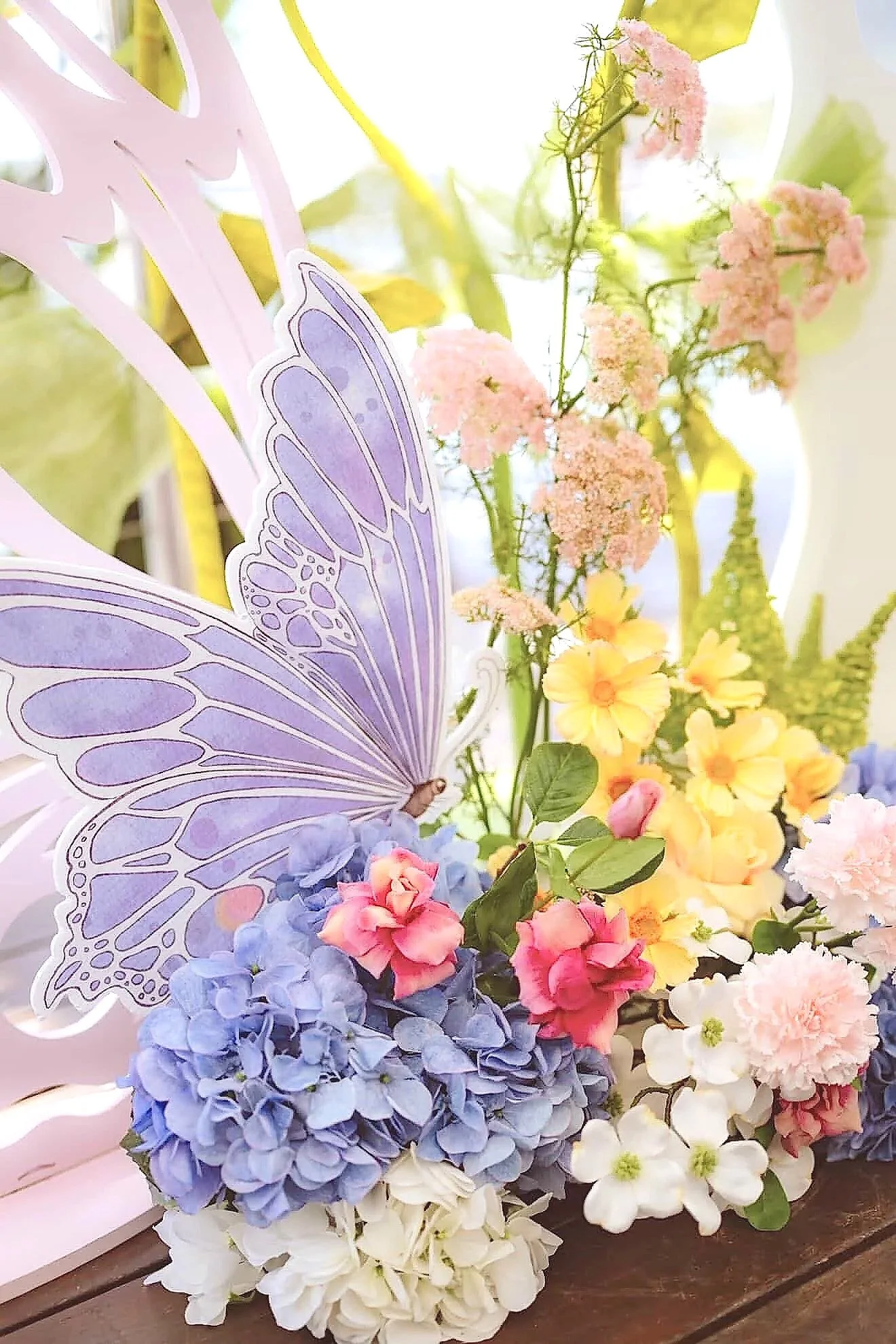 Butterfly faux floral arrangements