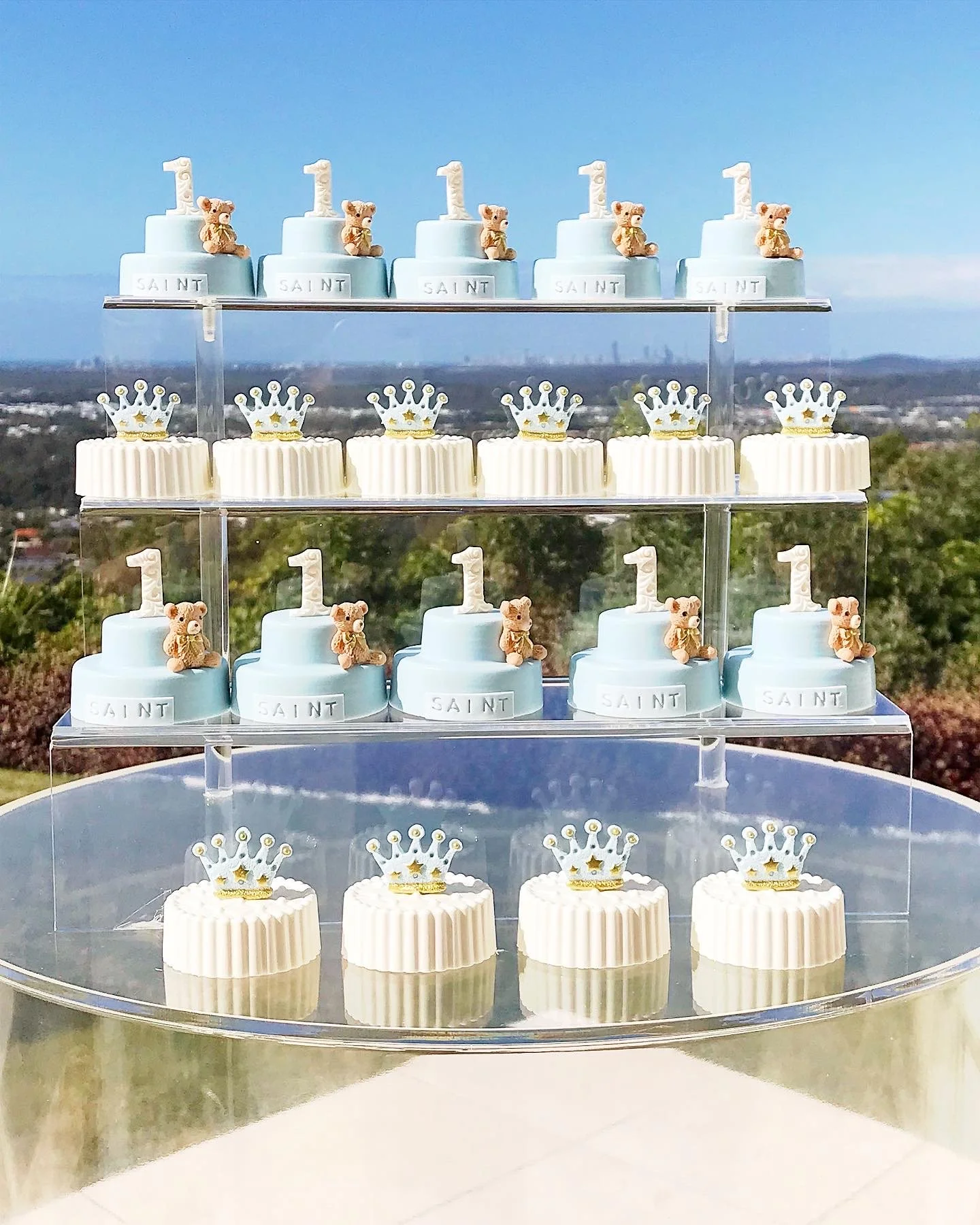 Tiered display of themed desserts for a first birthday celebration