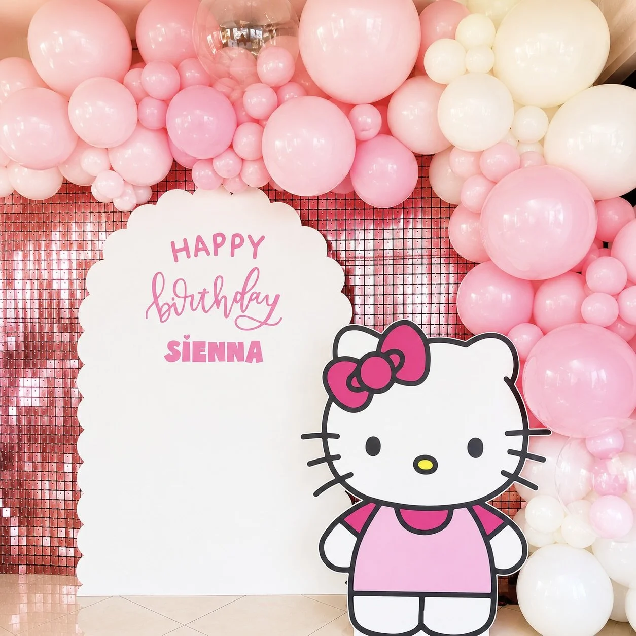 Hello Kitty birthday balloon and backdrop setup on the Gold Coast