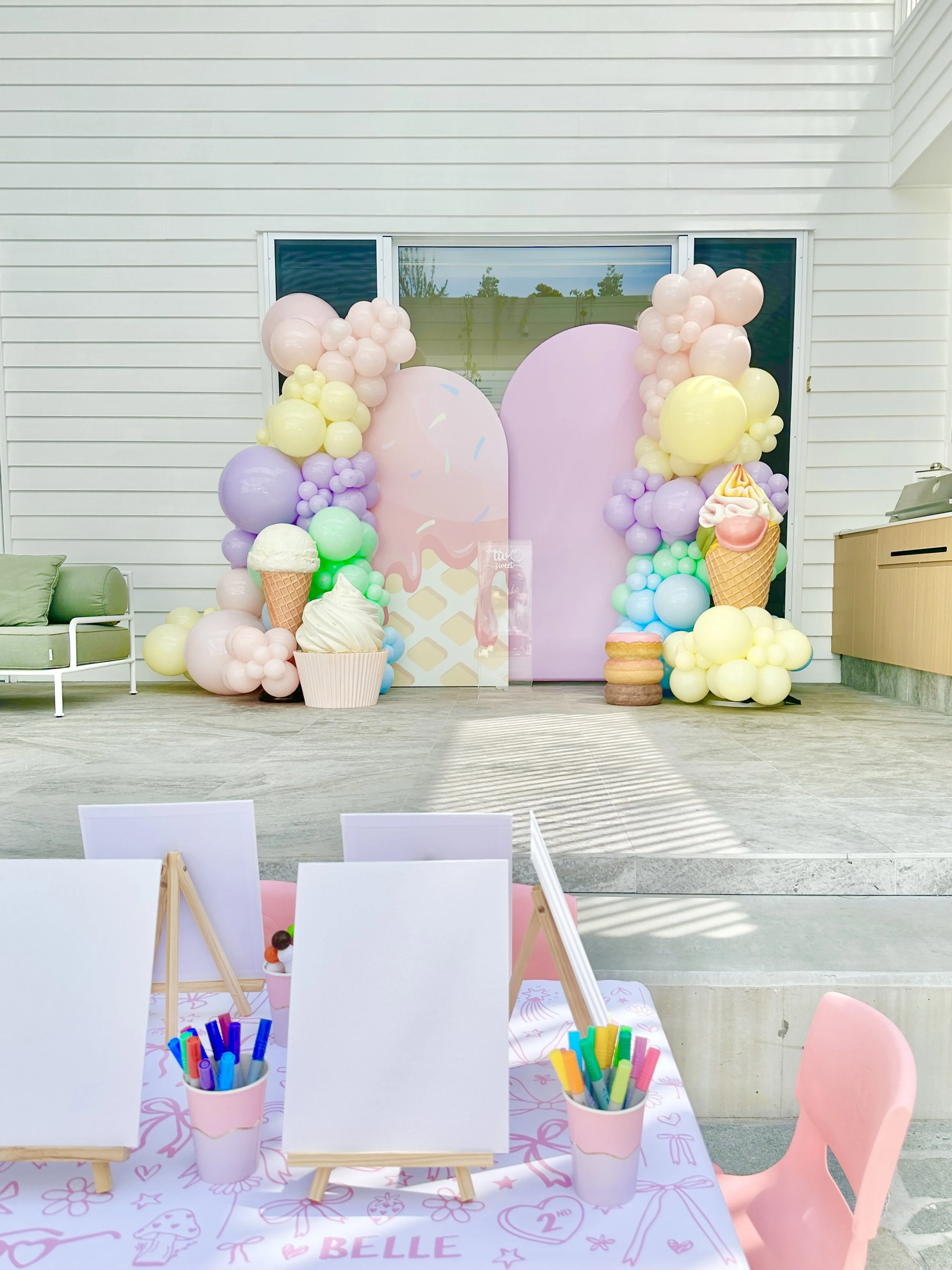 Two Sweet birthday party with balloons and life size ice cream and cupcake props