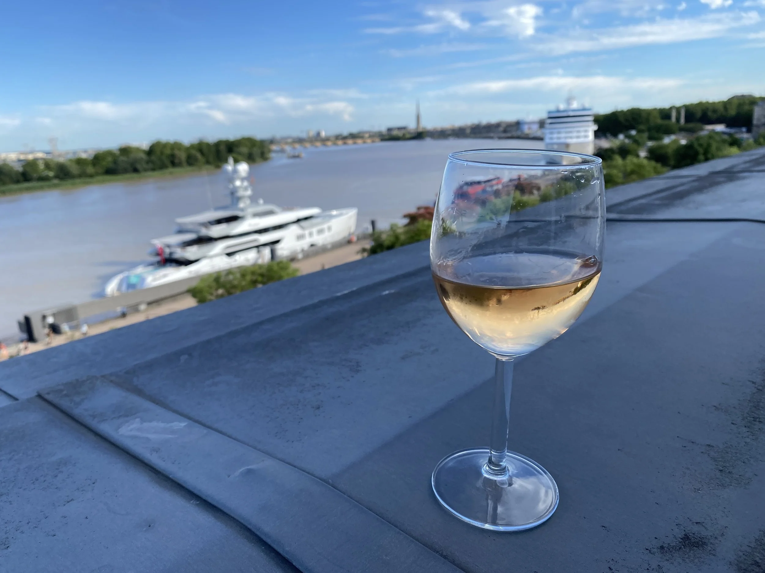 View of French river city representing lifestyle for Americans living in France