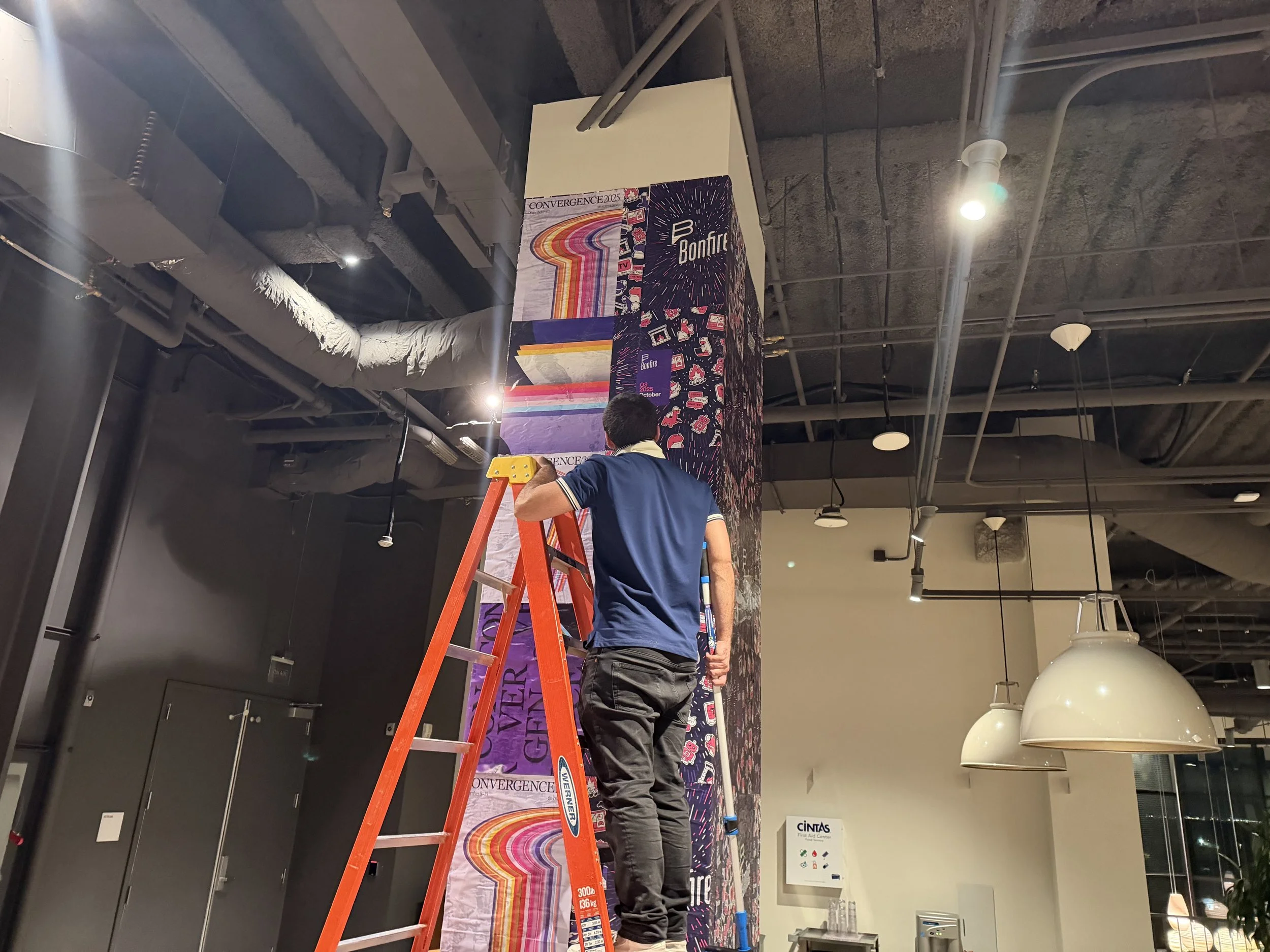 installer working on indoor wheat pasting for office space