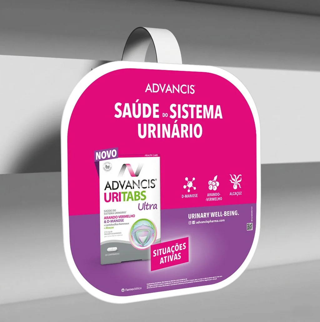 Pink and purple sign hanging from a hook advertising bladder health products. It features a box of Advancis Uri Tabs Ultra, a supplement for urinary health, with icons and text highlighting ingredients like D-mannose, red berries, and blueberries. Th