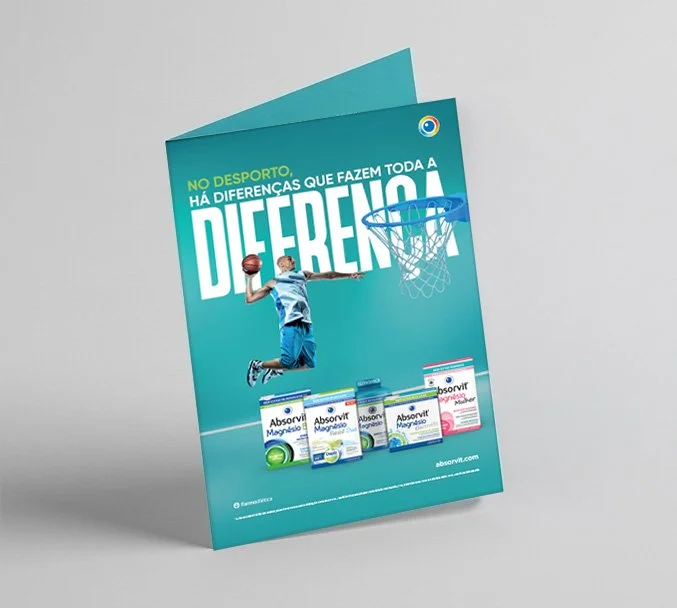 A print advertisement featuring a young boy in a basketball uniform jumping to dunk a basketball in front of a basketball hoop. The ad highlights Absorvit Magnesium supplements with various product packages at the bottom. The text reads, 'No Desporto