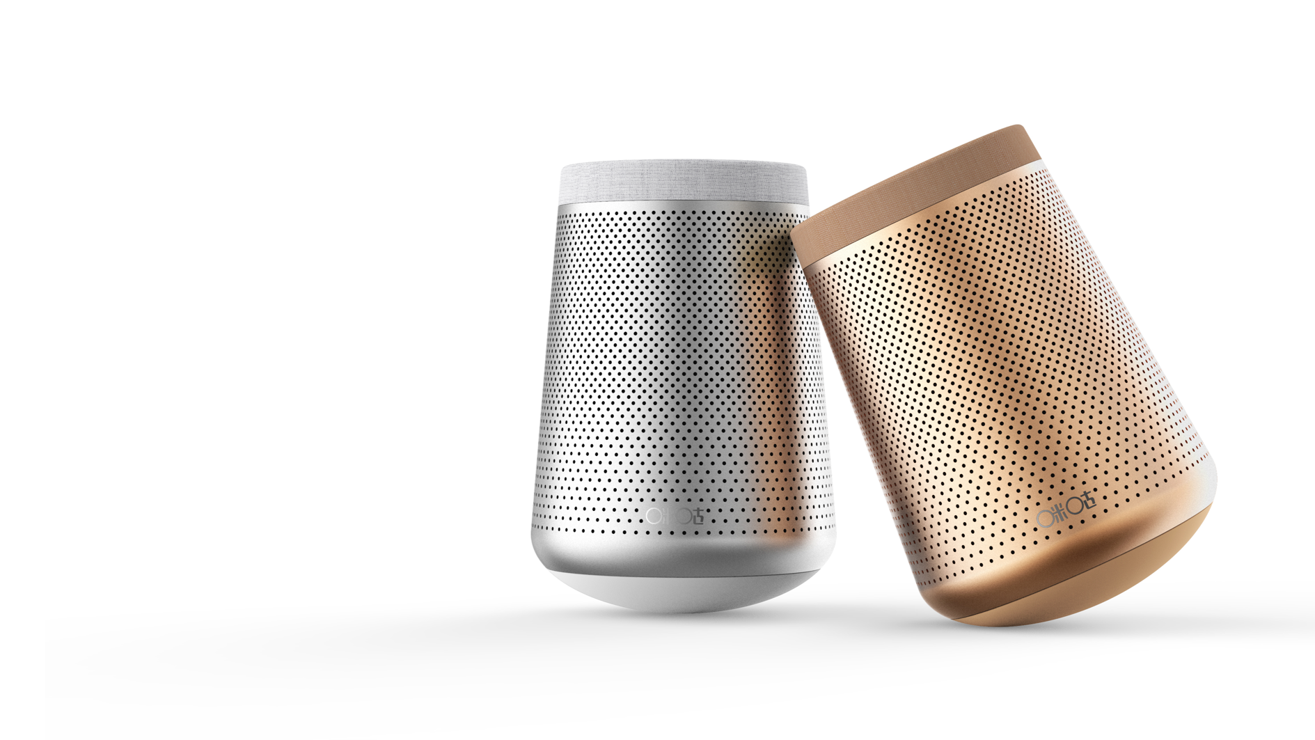 Two portable speakers, one silver and one gold, with a perforated design, placed on a white surface against a white background.