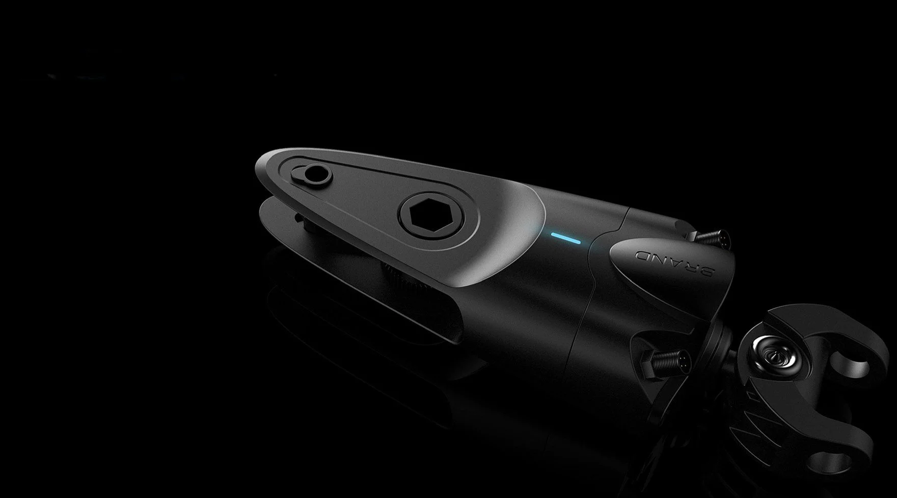 Black electric bicycle pedal assist motor with attached crank arm on a reflective black surface.