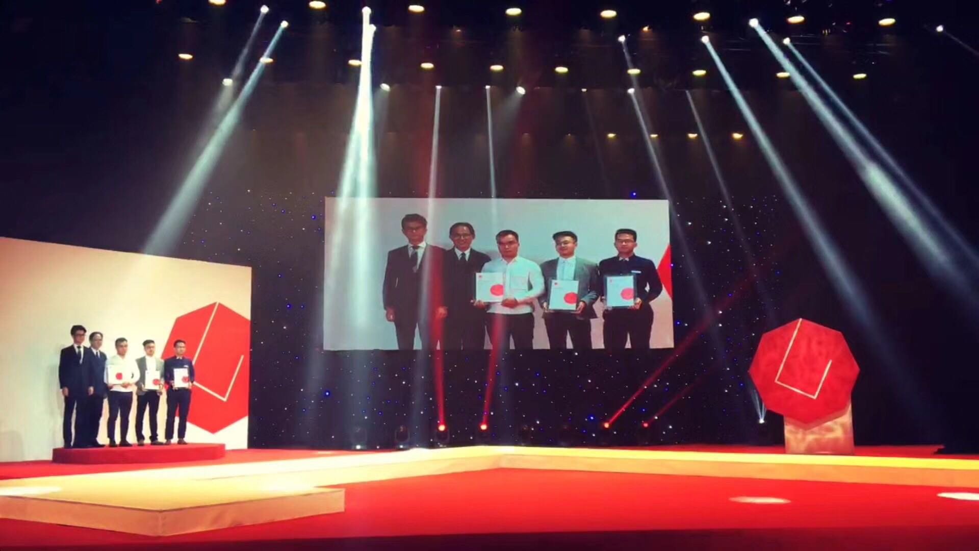 James Design team receiving international design honors. Proven track record in delivering market-ready, award-winning hardware solutions.