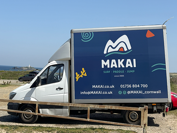 MAKAI vehicle graphics applied to branded van.