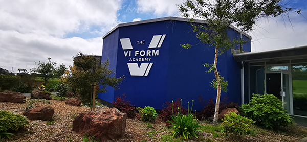 The VI Form Academy exterior signage and branded building.