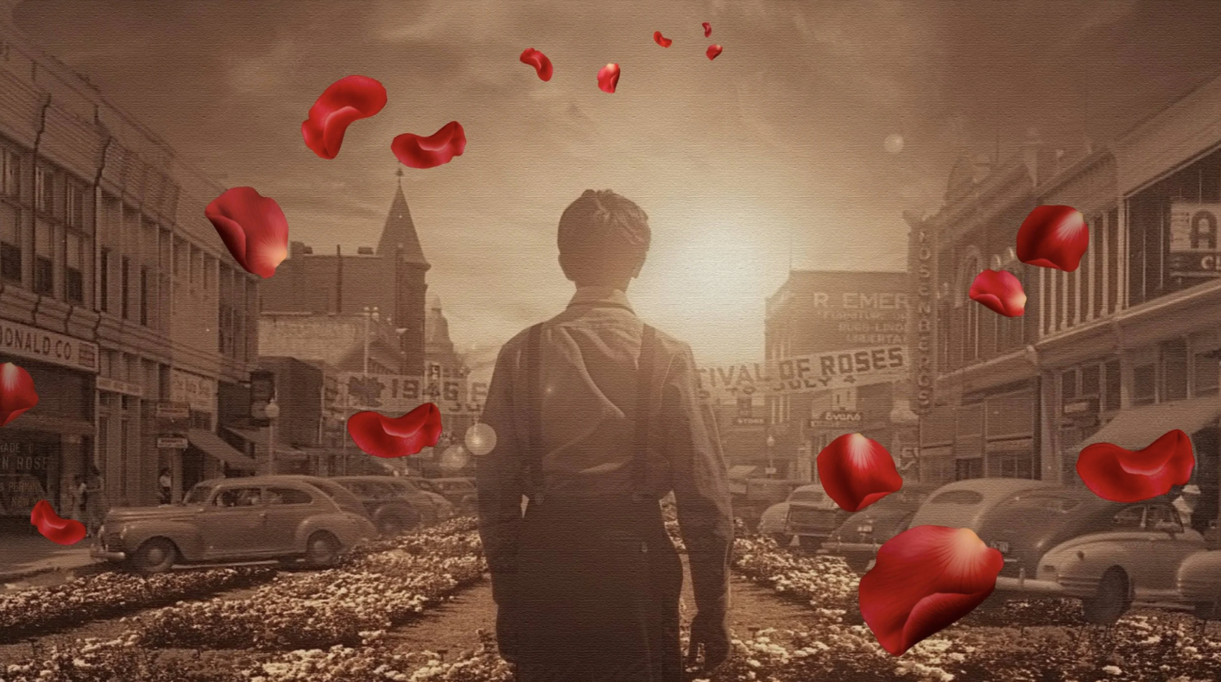 A person walking down a vintage street scene with rose petals floating in the air, sepia filter, and old buildings and cars in the background.