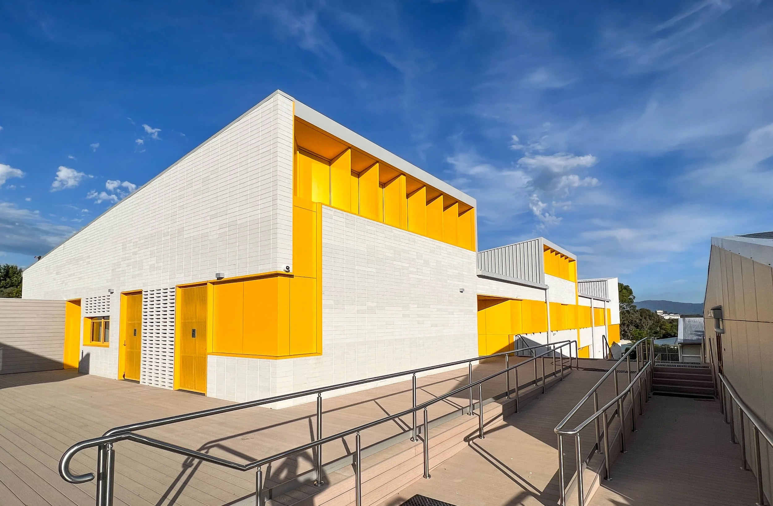 Colour for enhancing spaces at Norwood Secondary College with accessible ramps.