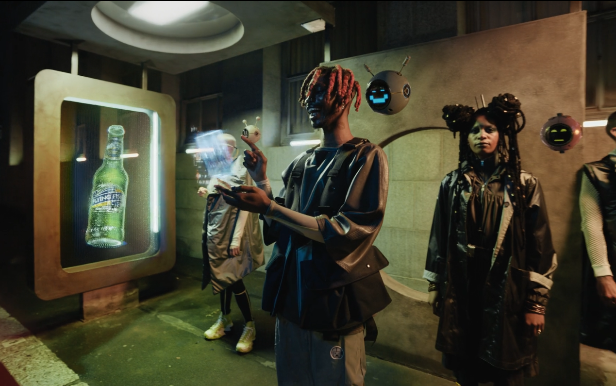 People in futuristic clothing with robotic accessories standing near a vending machine with a digital bottle display, in a cyberpunk-style setting.