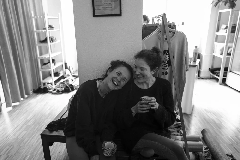 Members laughing together at Onda Yoga Studio
