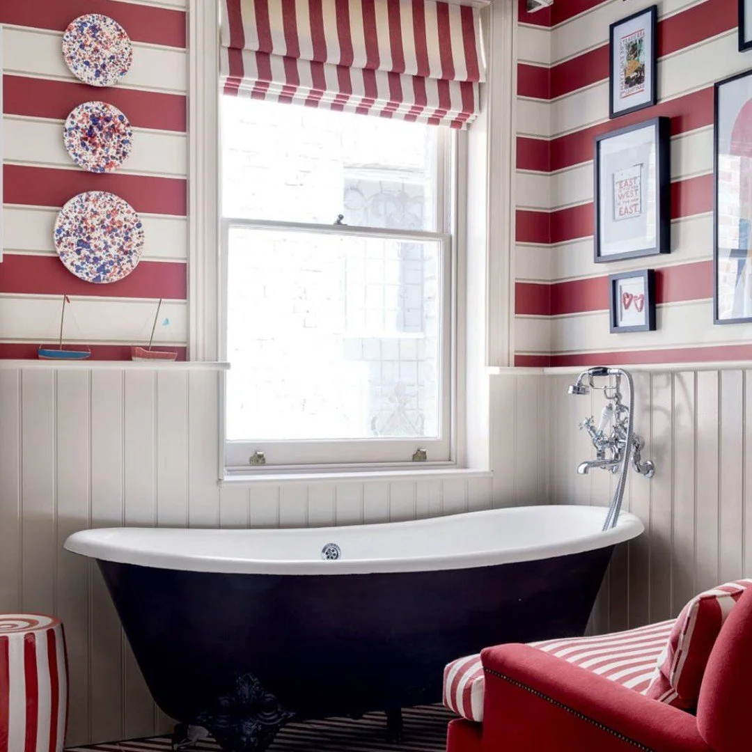 One colour, a stripe...and use it everywhere! 
Sticking to a 'theme' is a clever way of adding a sense of drama to a room. 
This family bathroom by Sarah Corbett-Winder (again, apologies, quite the style crush) is bursting with character. Fun, dramat