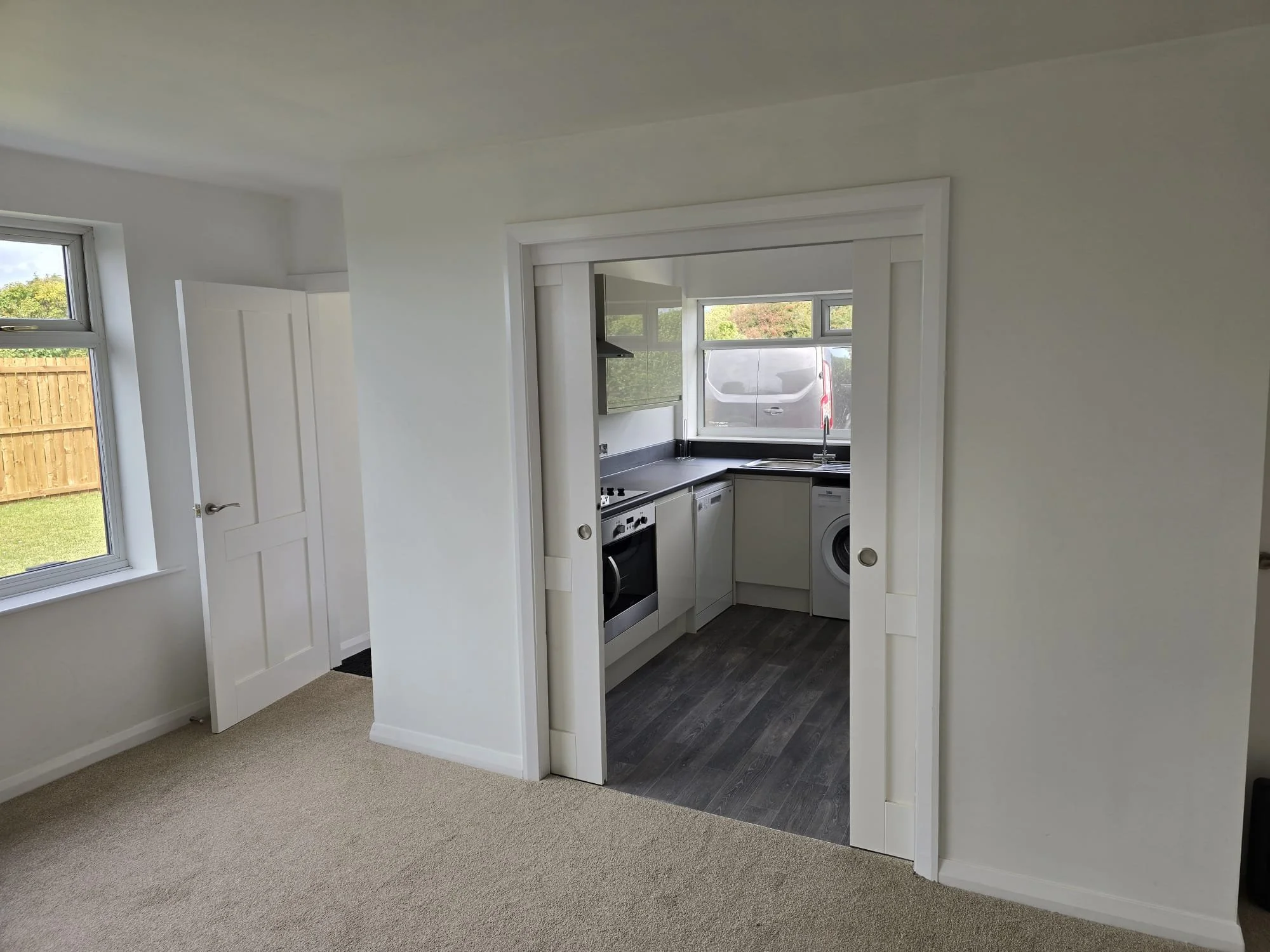 hidden utility room with sliding doors