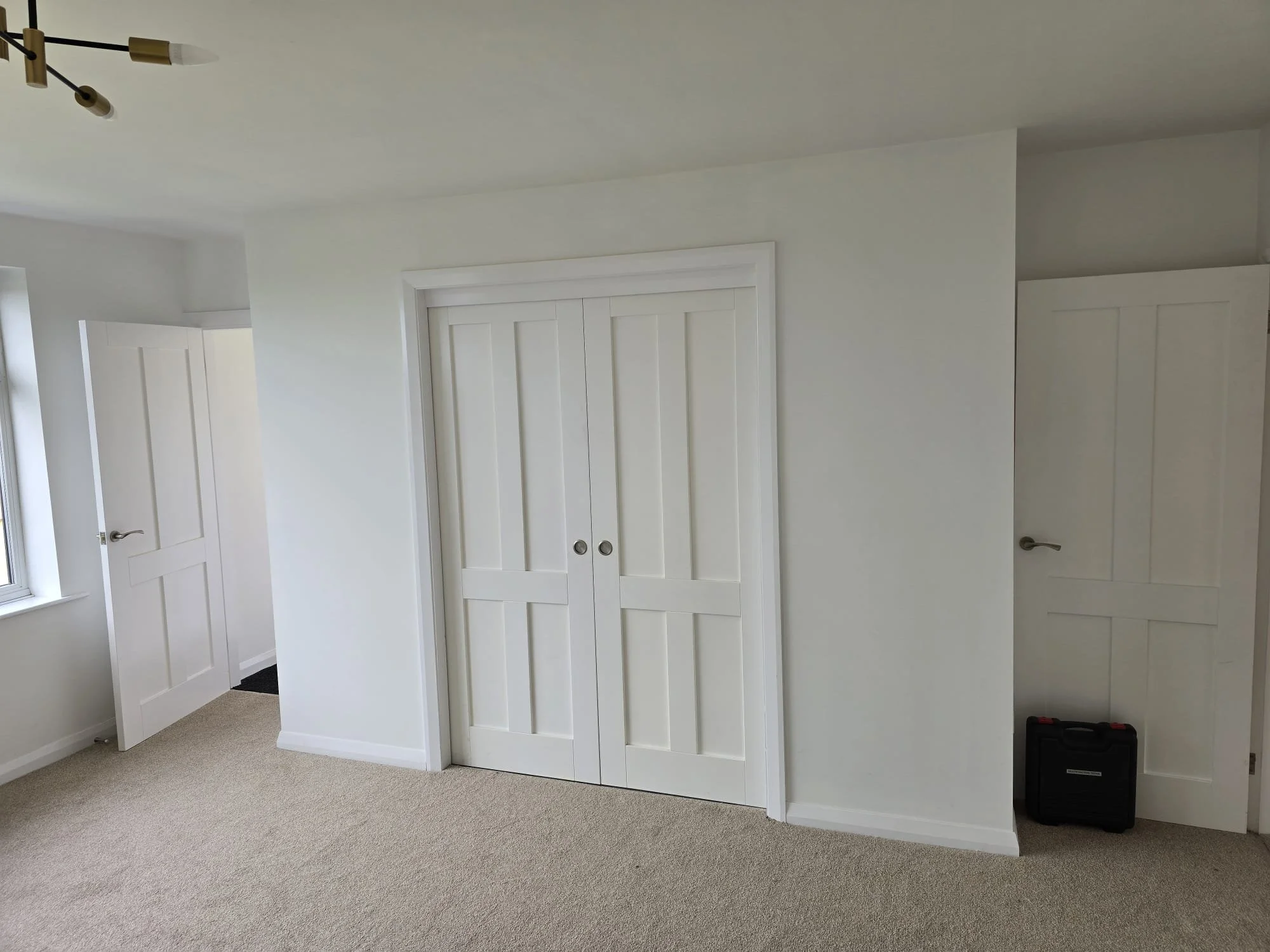 hidden utility room with sliding doors