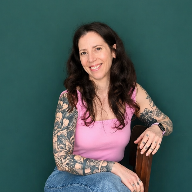 Headshot of smiling male tutor with medium-length black hair wearing a lanyard.