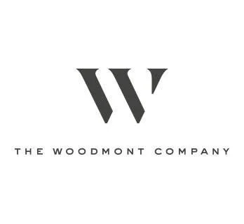 Logo of The Woodmont Company featuring a stylized 'W' above the company name