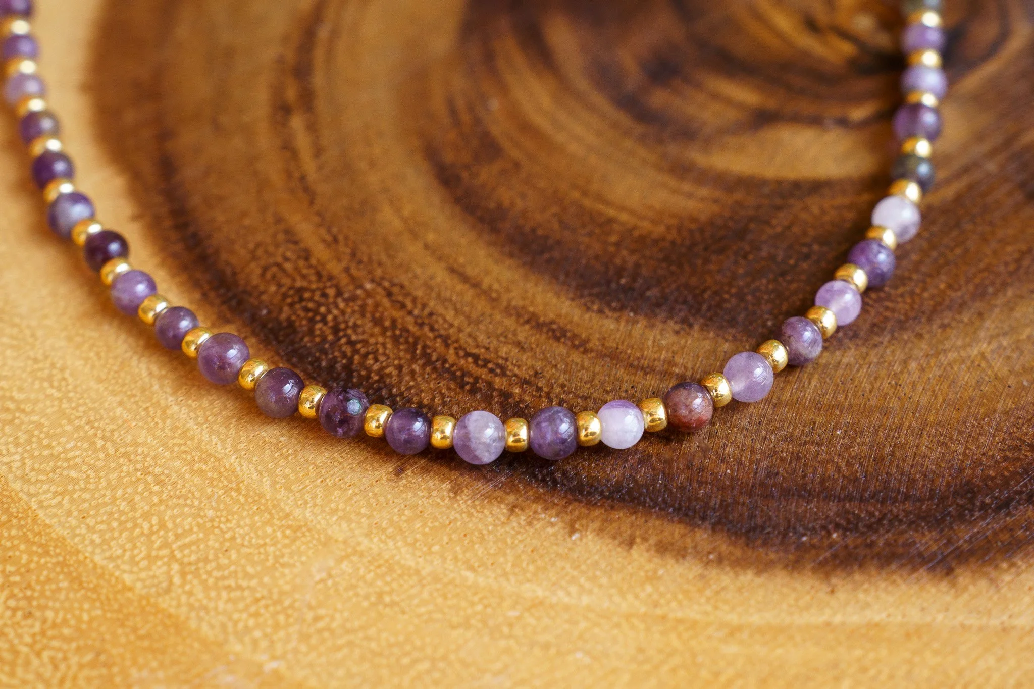 Handmade amethyst bead necklace with gold seed beads and 18k gold PVD findings. Necklace measures approximately 15.5" with a 2" extender.