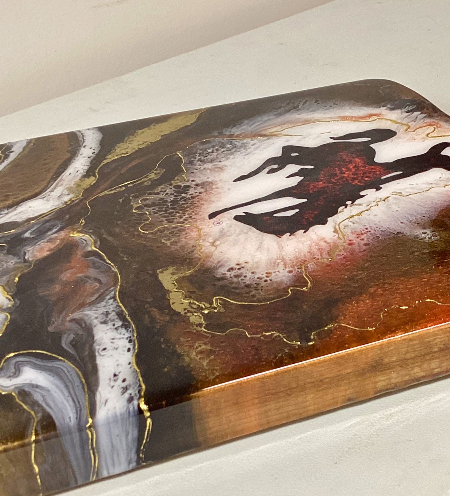 Handmade Wyoming Cowboy charcuterie board with resin art and 24K gold accents. A one-of-a-kind serving piece that doubles as Western wall art.