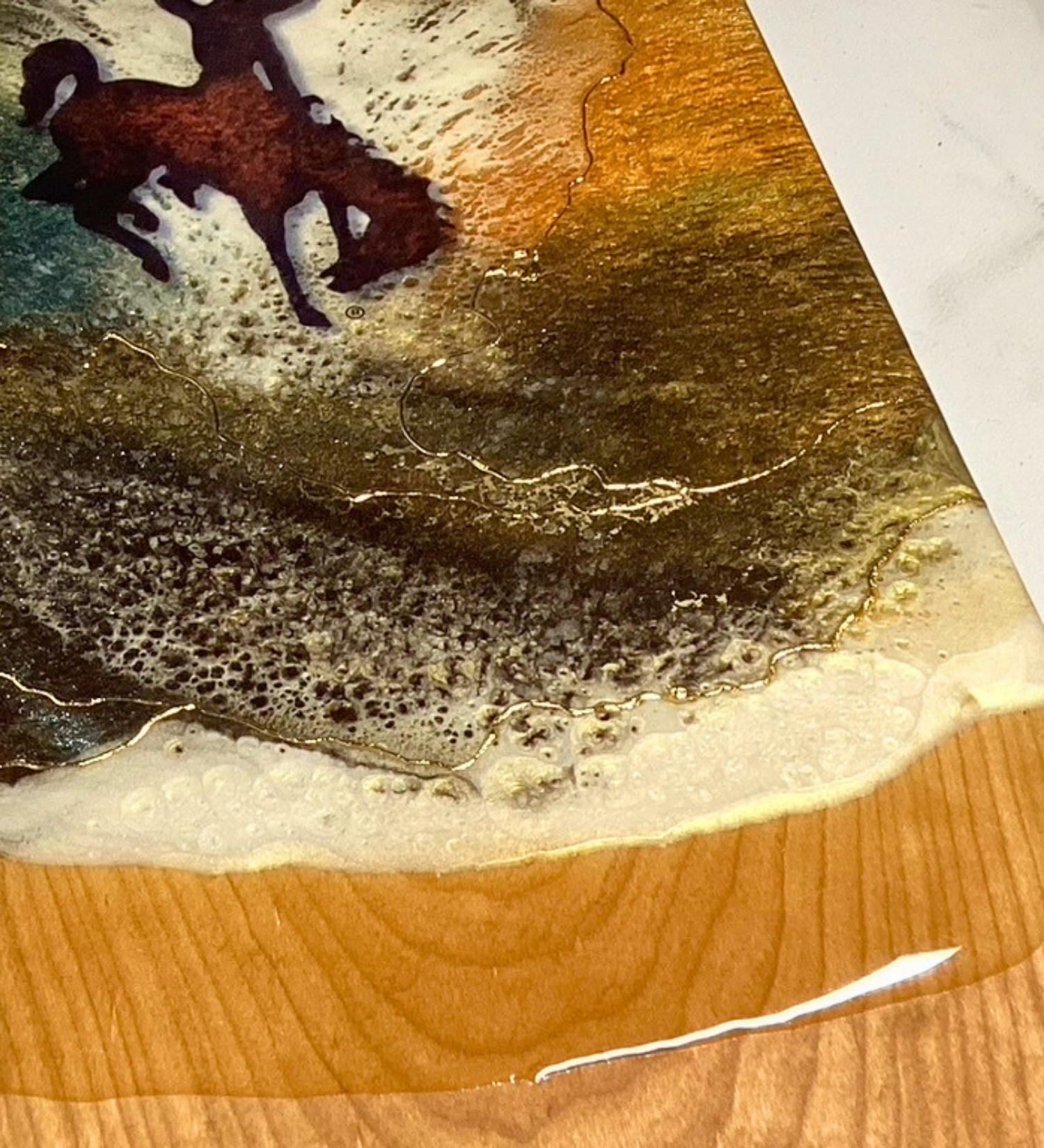 Handmade Wyoming cowboy charcuterie board with resin art and 24K gold accents on solid hardwood serving board