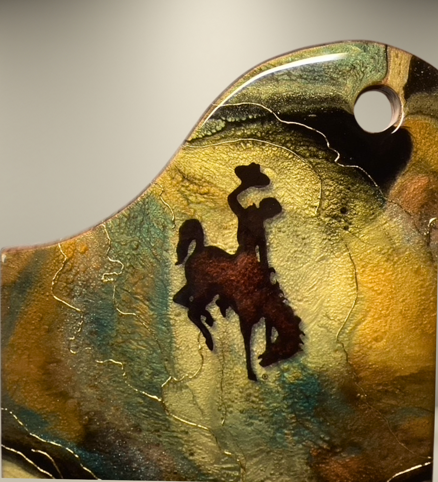 Handcrafted Wyoming cowboy charcuterie board featuring flowing resin art on acacia wood. A one-of-a-kind Western serving board and artisan kitchen gift.