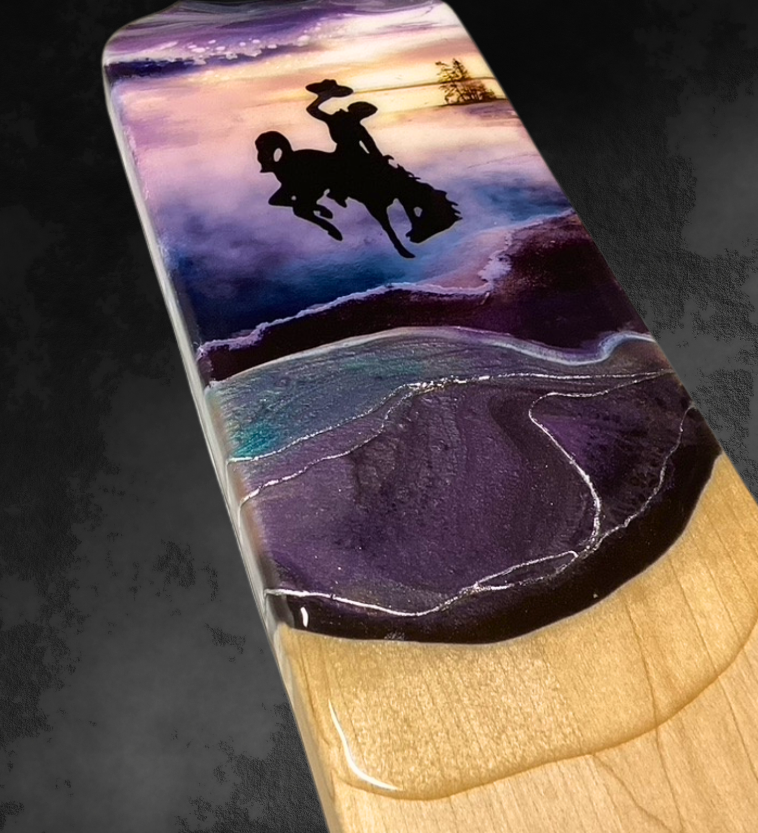 Handmade maple baguette serving board with turquoise blue and plum geothermal resin art inspired by Yellowstone and featuring the Wyoming bucking horse logo