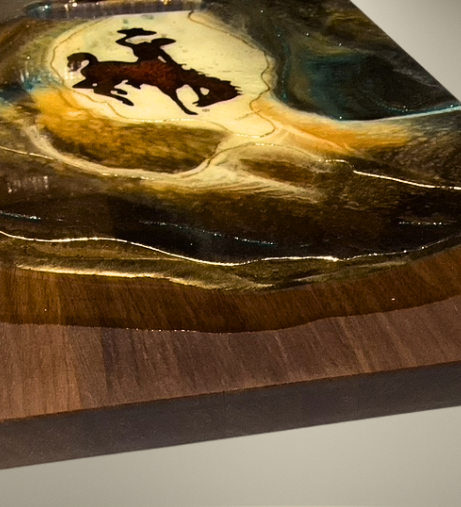 Handcrafted Wyoming cowboy charcuterie board featuring flowing resin art on walnut hardwood.