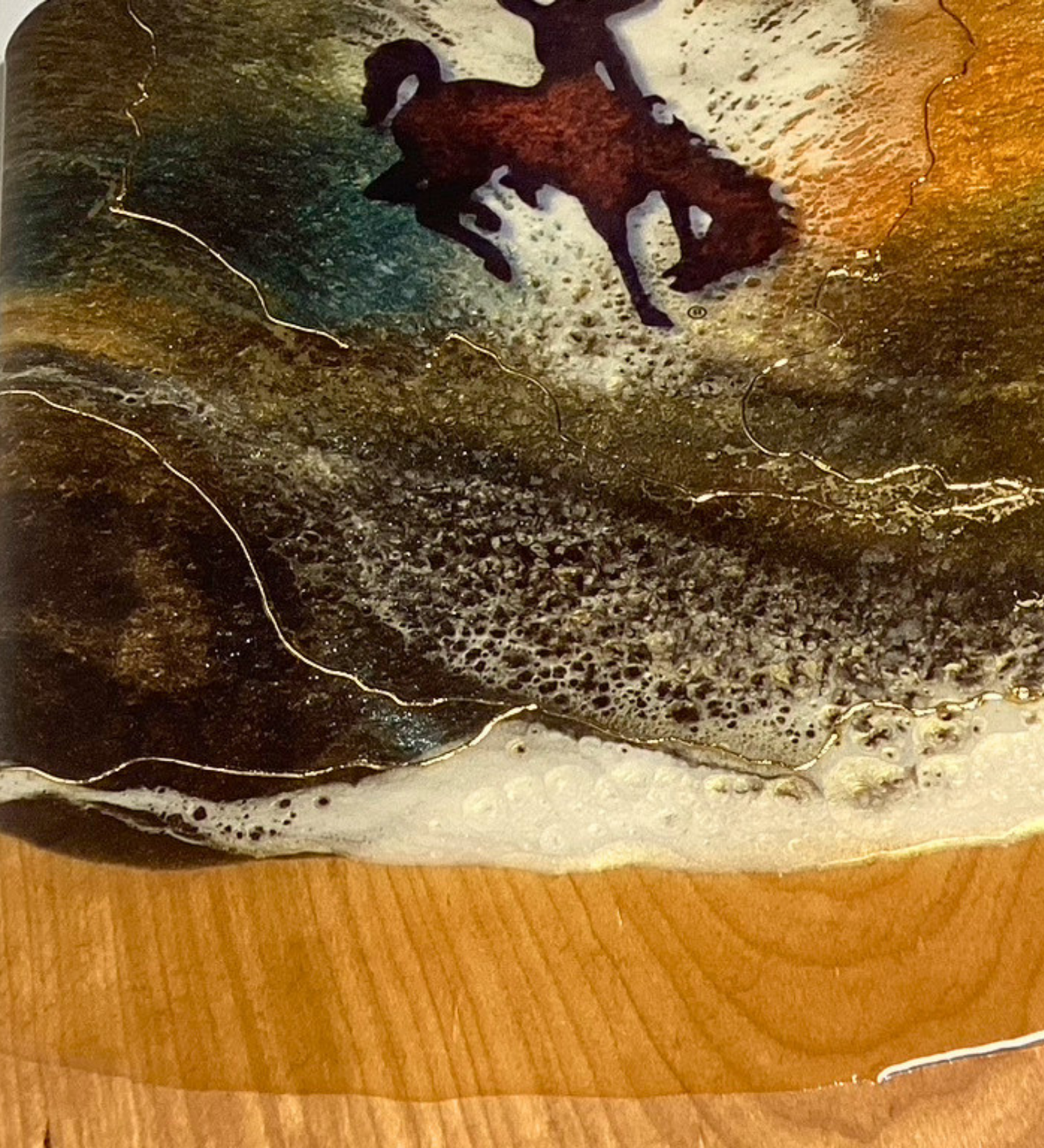 Handmade Wyoming cowboy charcuterie board with resin art and 24K gold accents on solid hardwood serving board