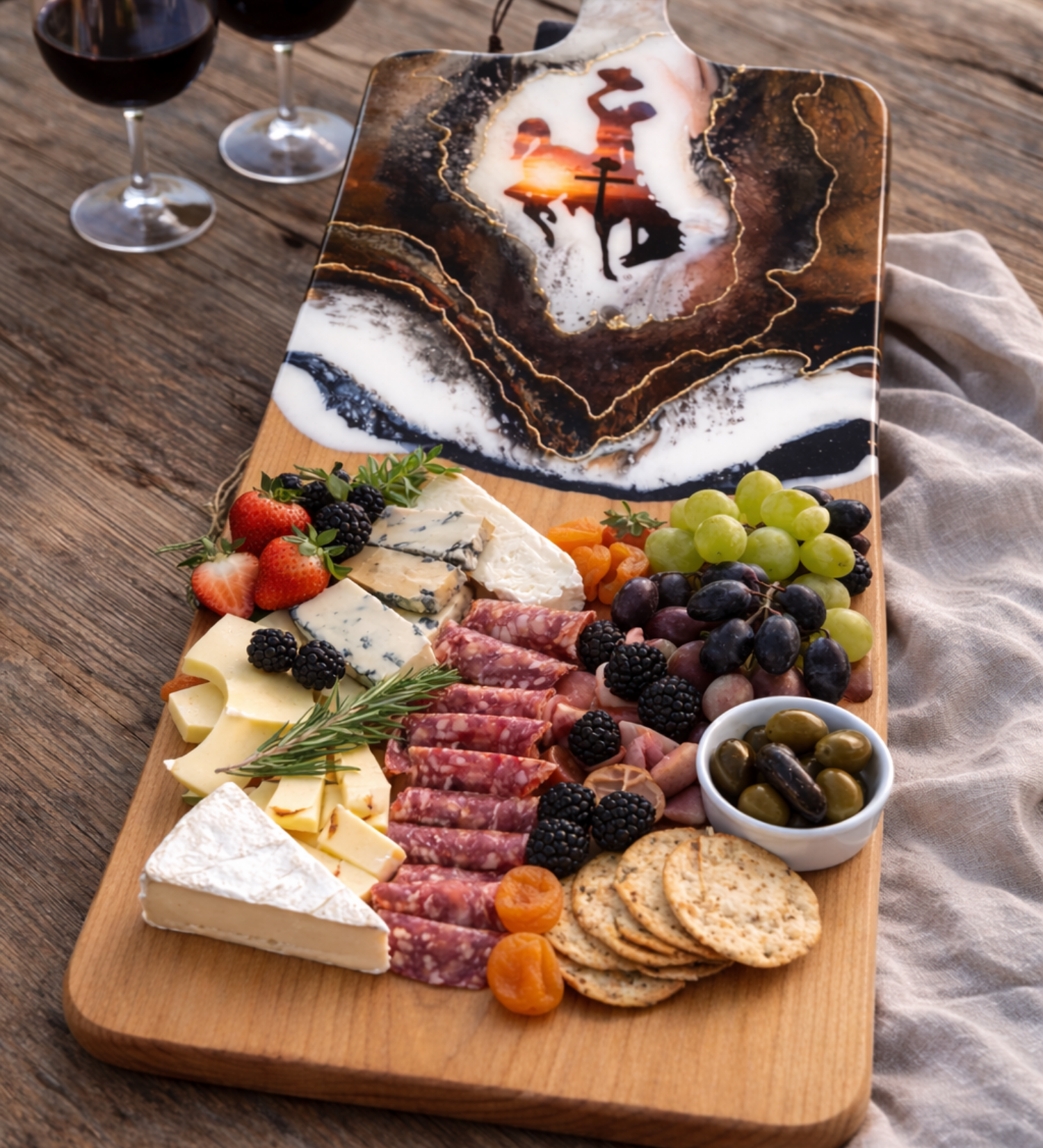 Handmade Wyoming Cowboy charcuterie board with cross and sunset design, gold resin artwork on hardwood serving board