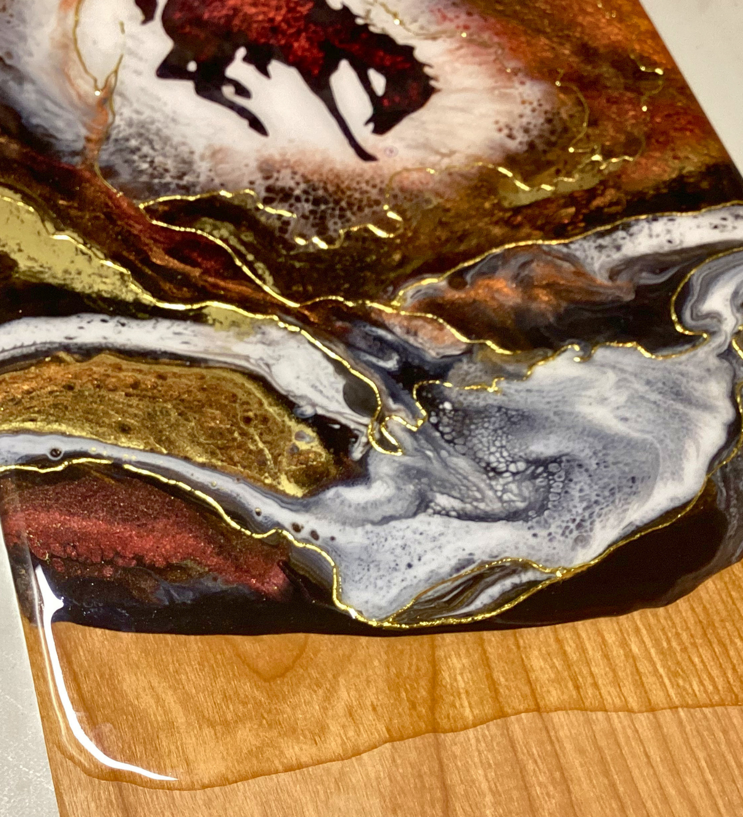 Handmade Wyoming Cowboy charcuterie board with resin art and 24K gold accents. A one-of-a-kind serving piece that doubles as Western wall art.