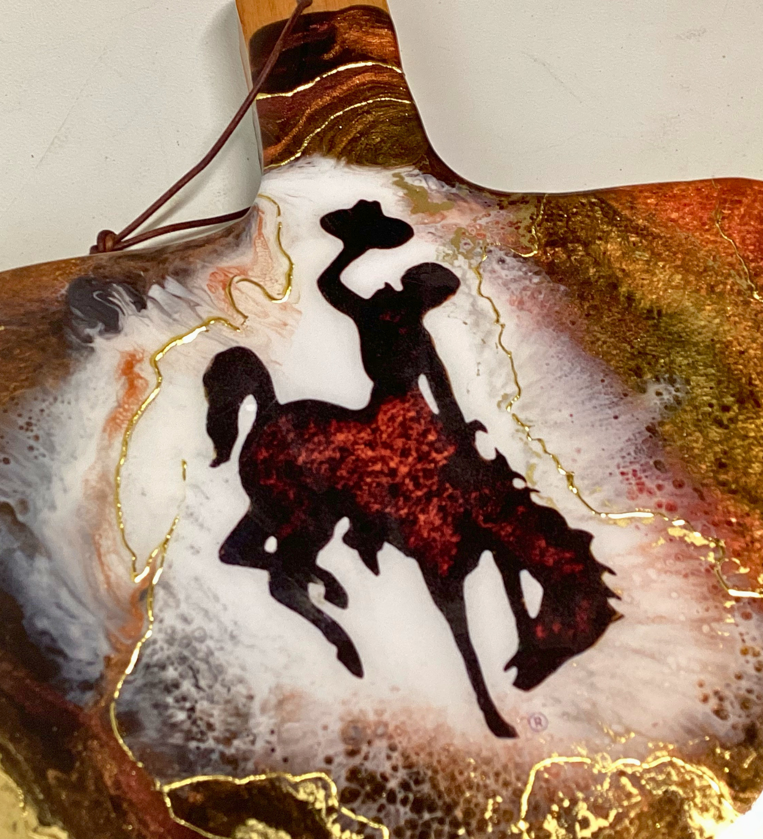 Handmade Wyoming Cowboy charcuterie board with resin art and 24K gold accents. A one-of-a-kind serving piece that doubles as Western wall art.