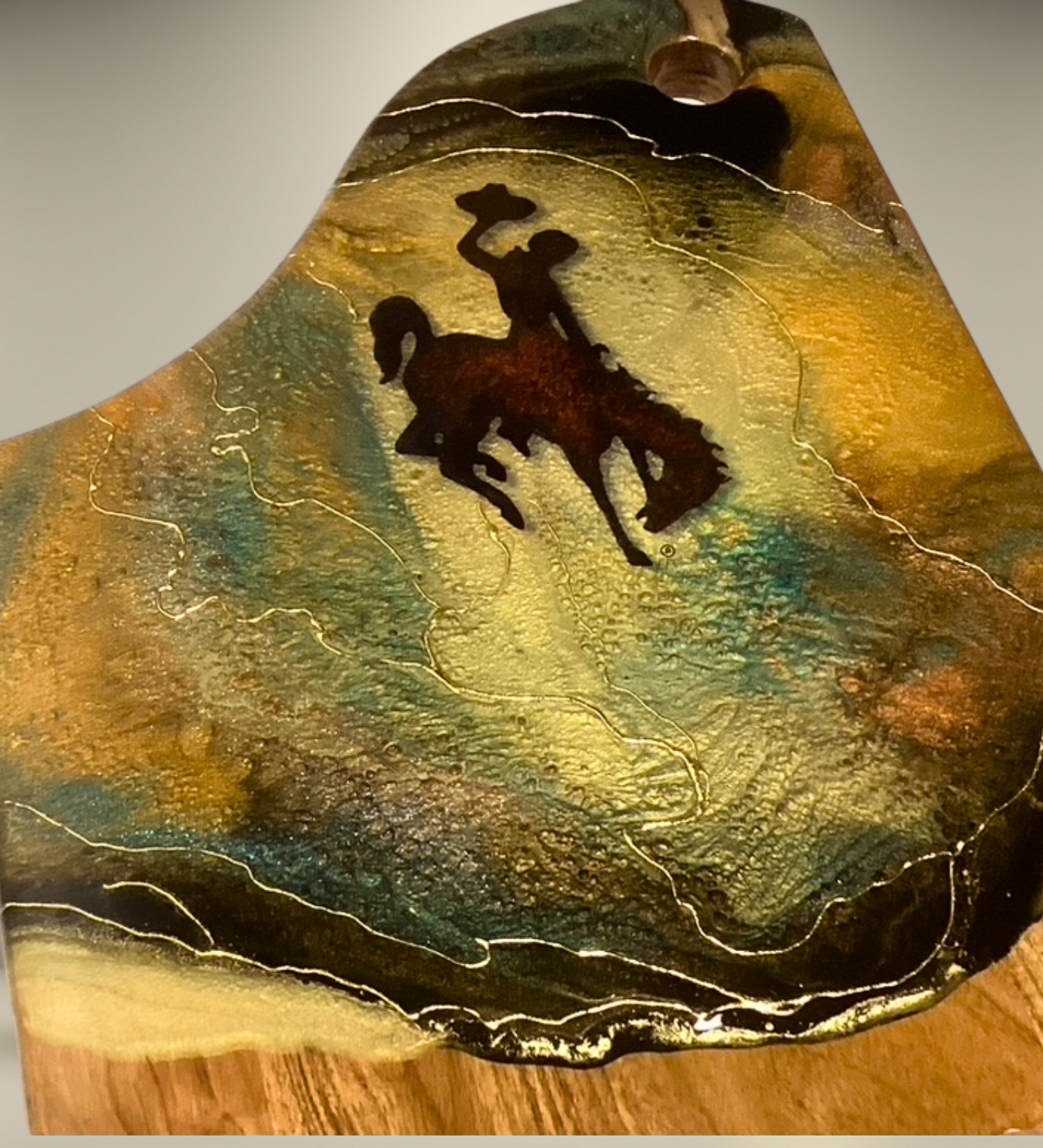 Handcrafted Wyoming cowboy charcuterie board featuring flowing resin art on acacia wood. A one-of-a-kind Western serving board and artisan kitchen gift.