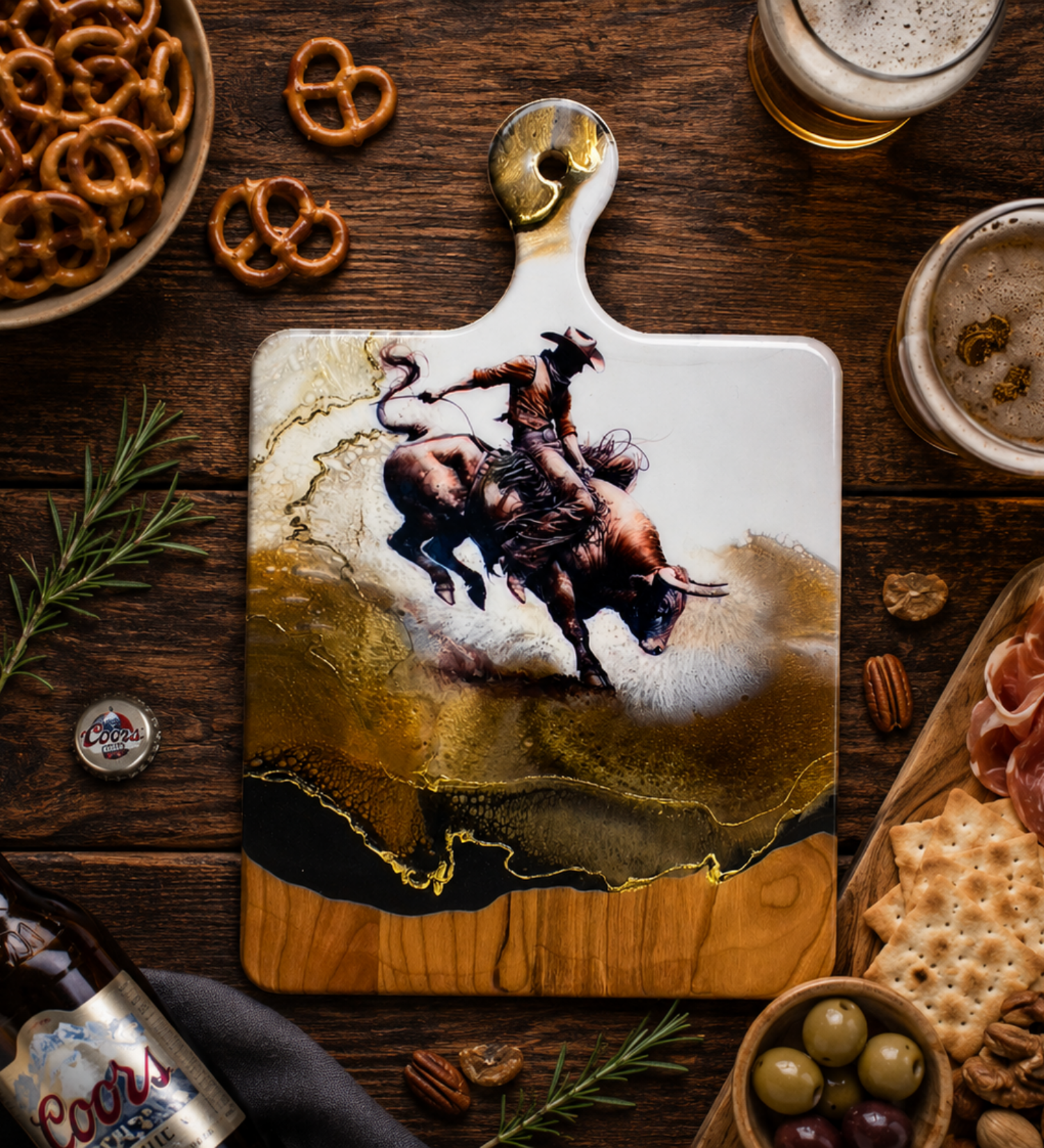 Rustic flat lay featuring a handmade bull rider charcuterie board with beer, pretzels, meats, cheeses, and crackers.
