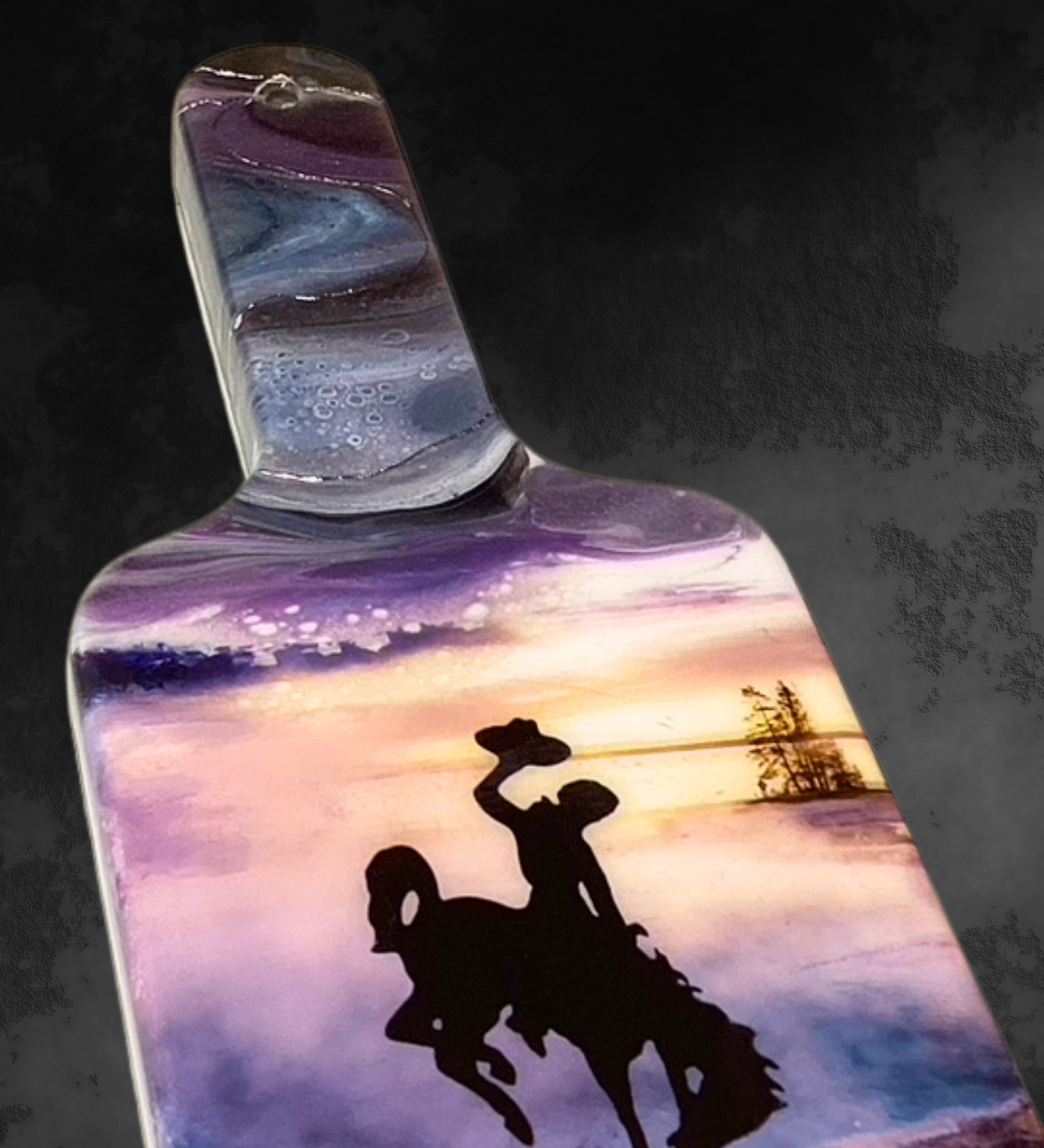 Handmade maple baguette serving board with turquoise blue and plum geothermal resin art inspired by Yellowstone and featuring the Wyoming bucking horse logo