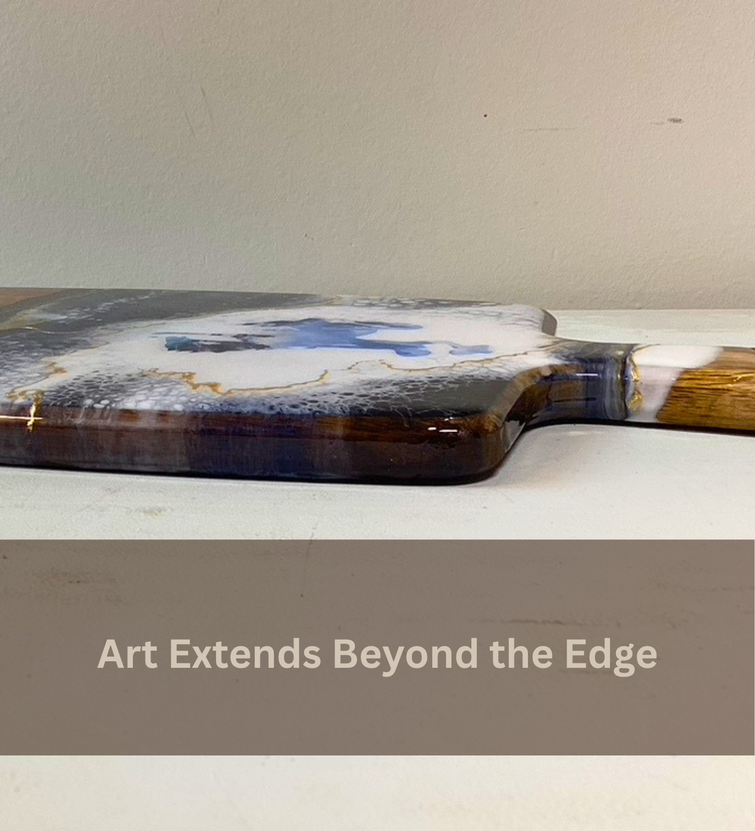 Handmade Wyoming charcuterie board with fly fisherman scene, resin art, and 24K gold accents on acacia wood