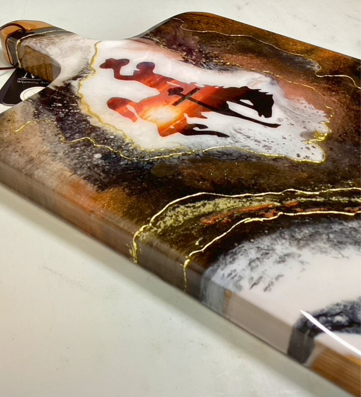 Handmade Wyoming Cowboy charcuterie board with cross and sunset design, gold resin artwork on hardwood serving board