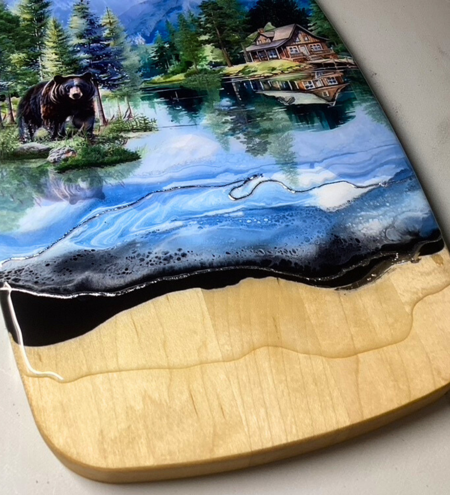 Handcrafted black bear and cabin charcuterie board with resin artwork on maple hardwood serving board.