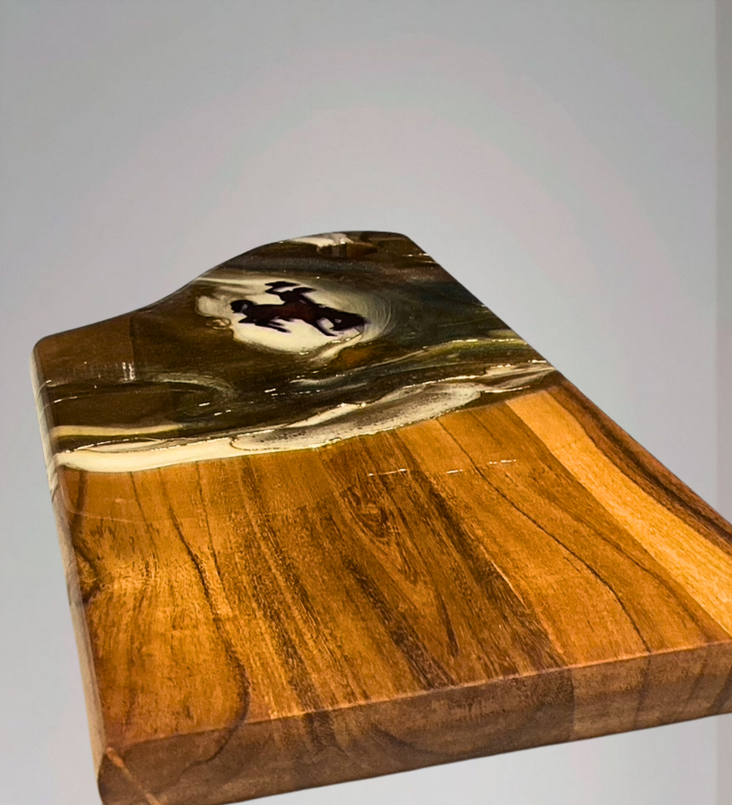 Handmade acacia wood charcuterie board with bucking horse design, resin art, and 24K gold accents inspired by Wyoming western heritage