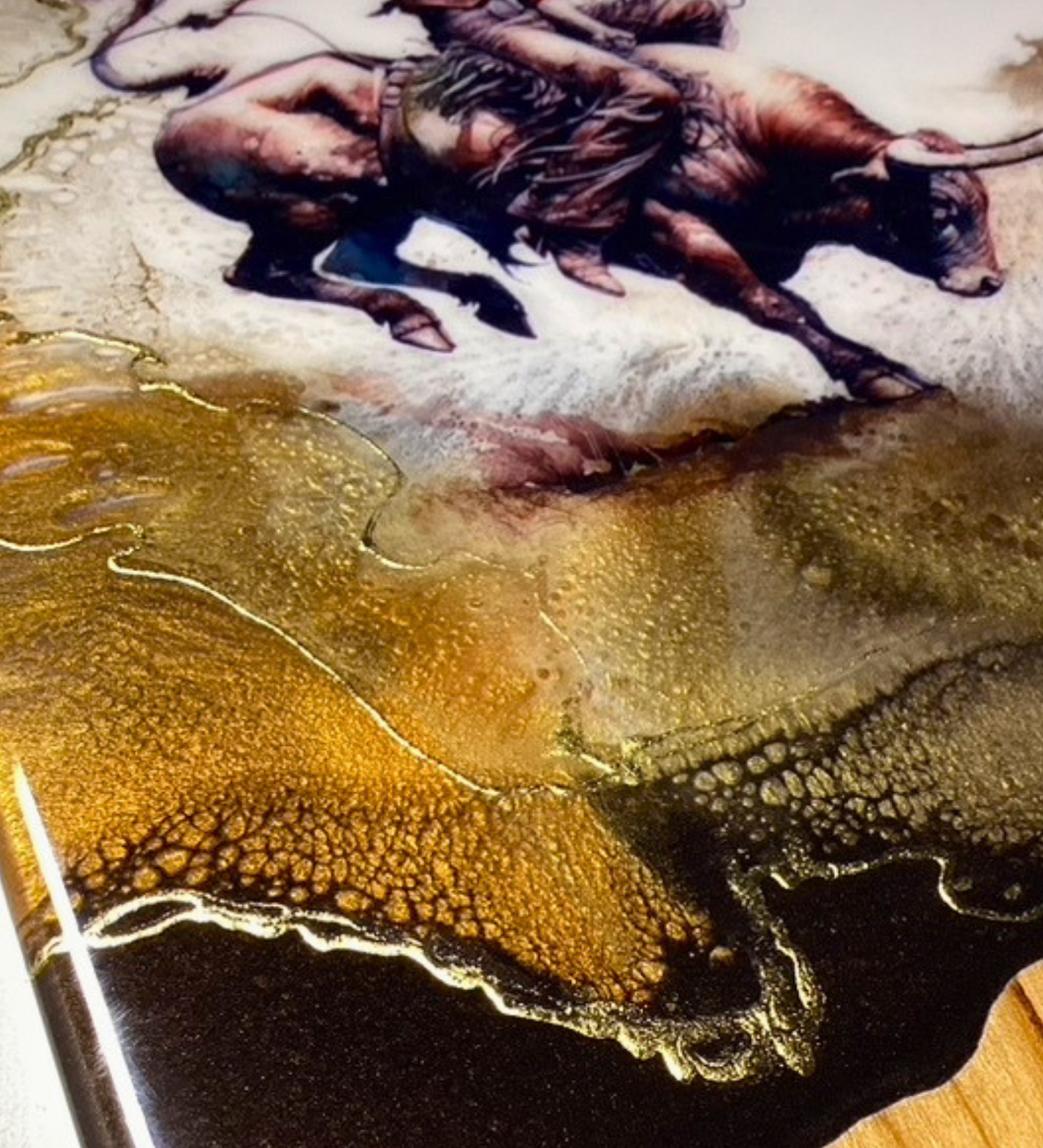 Handmade western charcuterie board featuring bull rider artwork with gold resin accents on natural wood