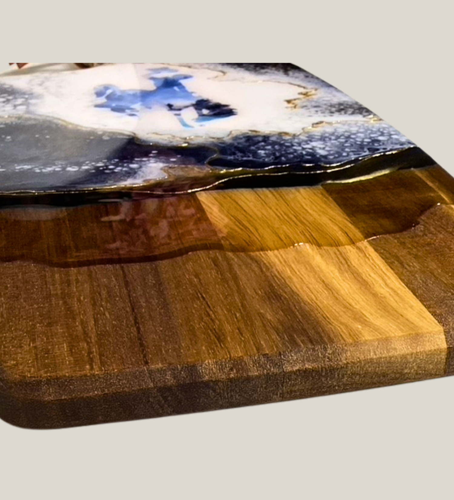 Handmade Wyoming charcuterie board with fly fisherman scene, resin art, and 24K gold accents on acacia wood