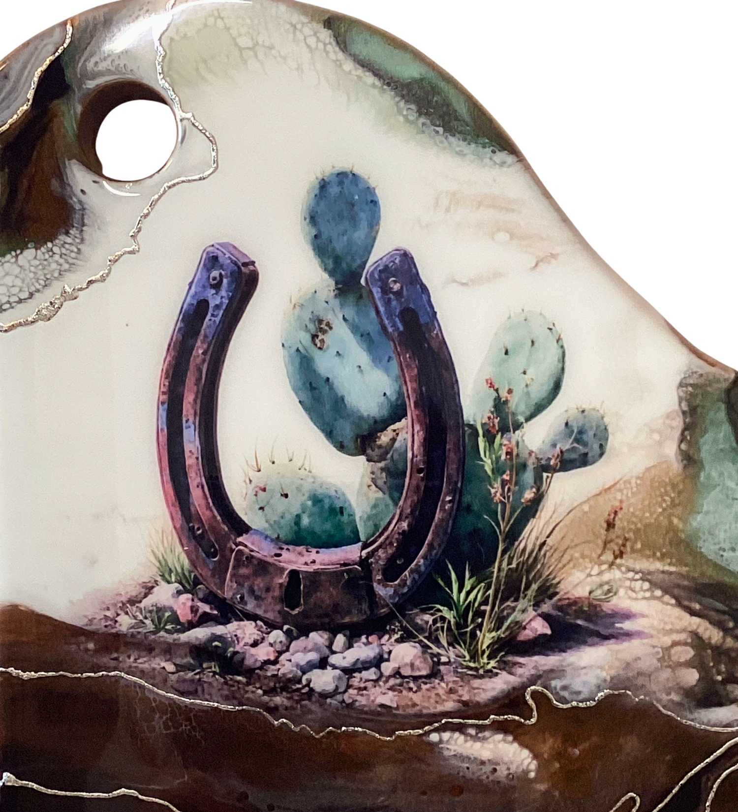 Handcrafted acacia charcuterie board featuring a rustic horseshoe standing upright with cactus behind it, accented with pure silver, Western décor style.