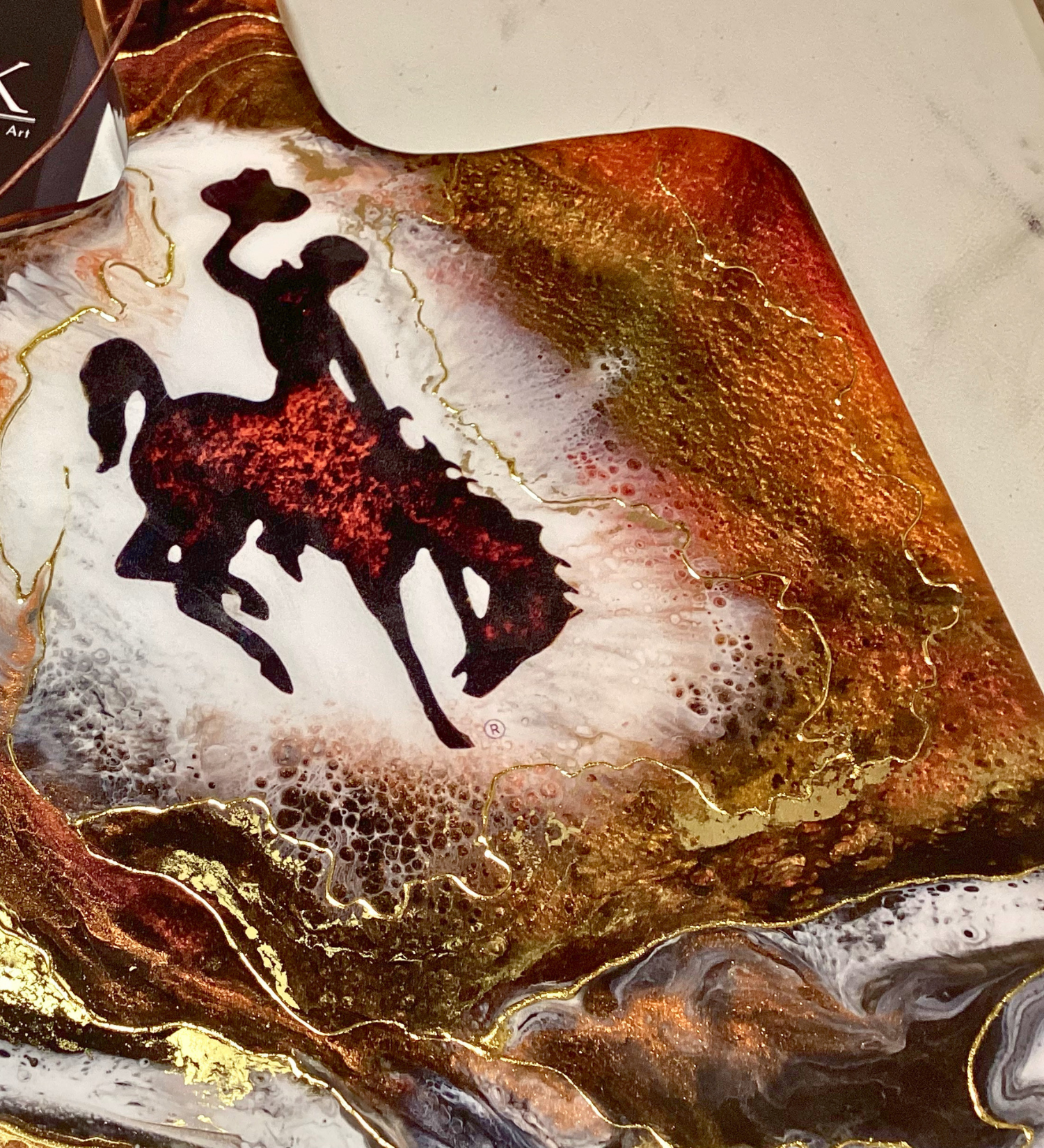 Handmade Wyoming Cowboy charcuterie board with resin art and 24K gold accents. A one-of-a-kind serving piece that doubles as Western wall art.