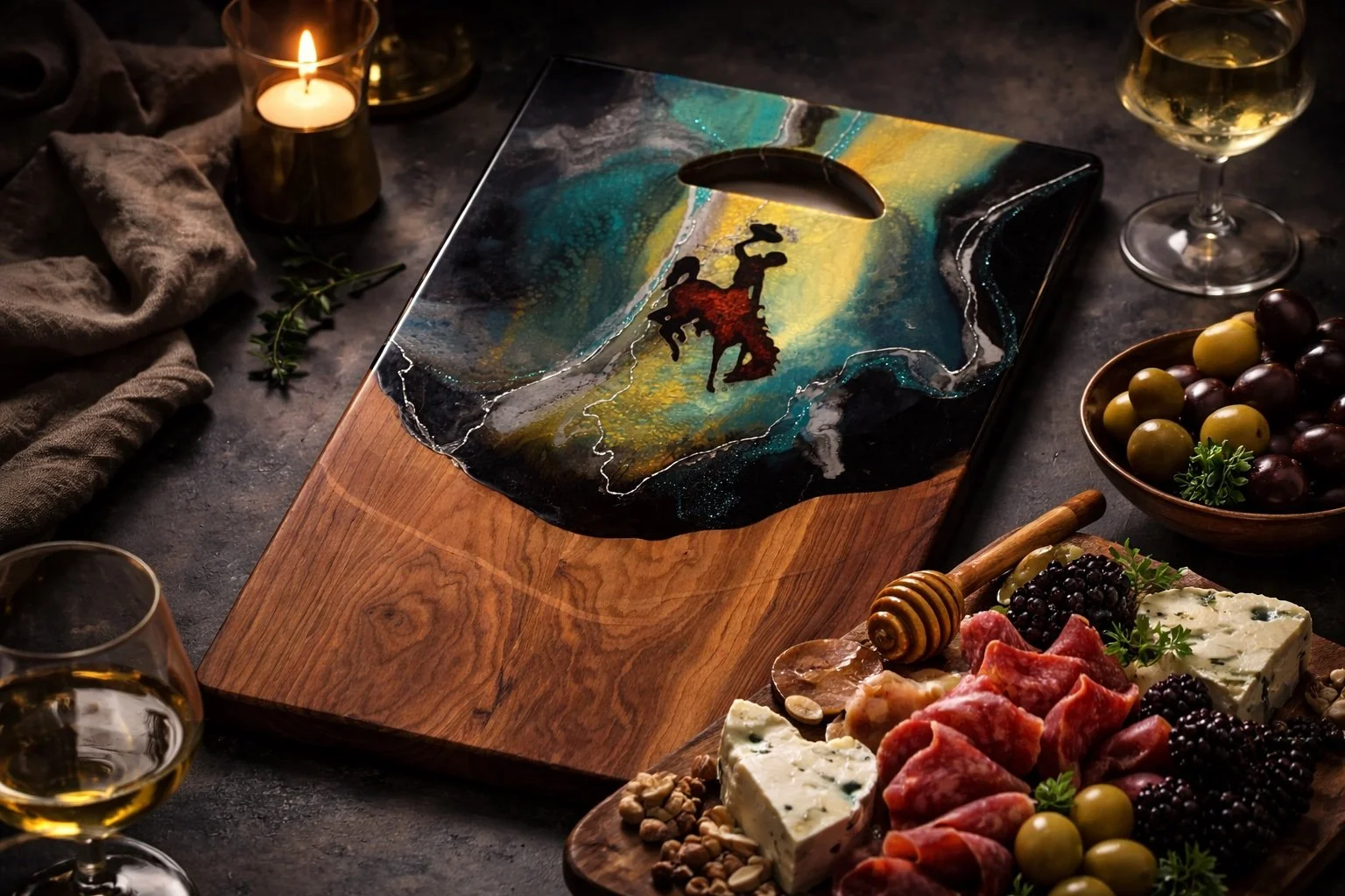 Handcrafted Wyoming cowboy charcuterie board with teal and gold resin artwork on cherry hardwood serving board.