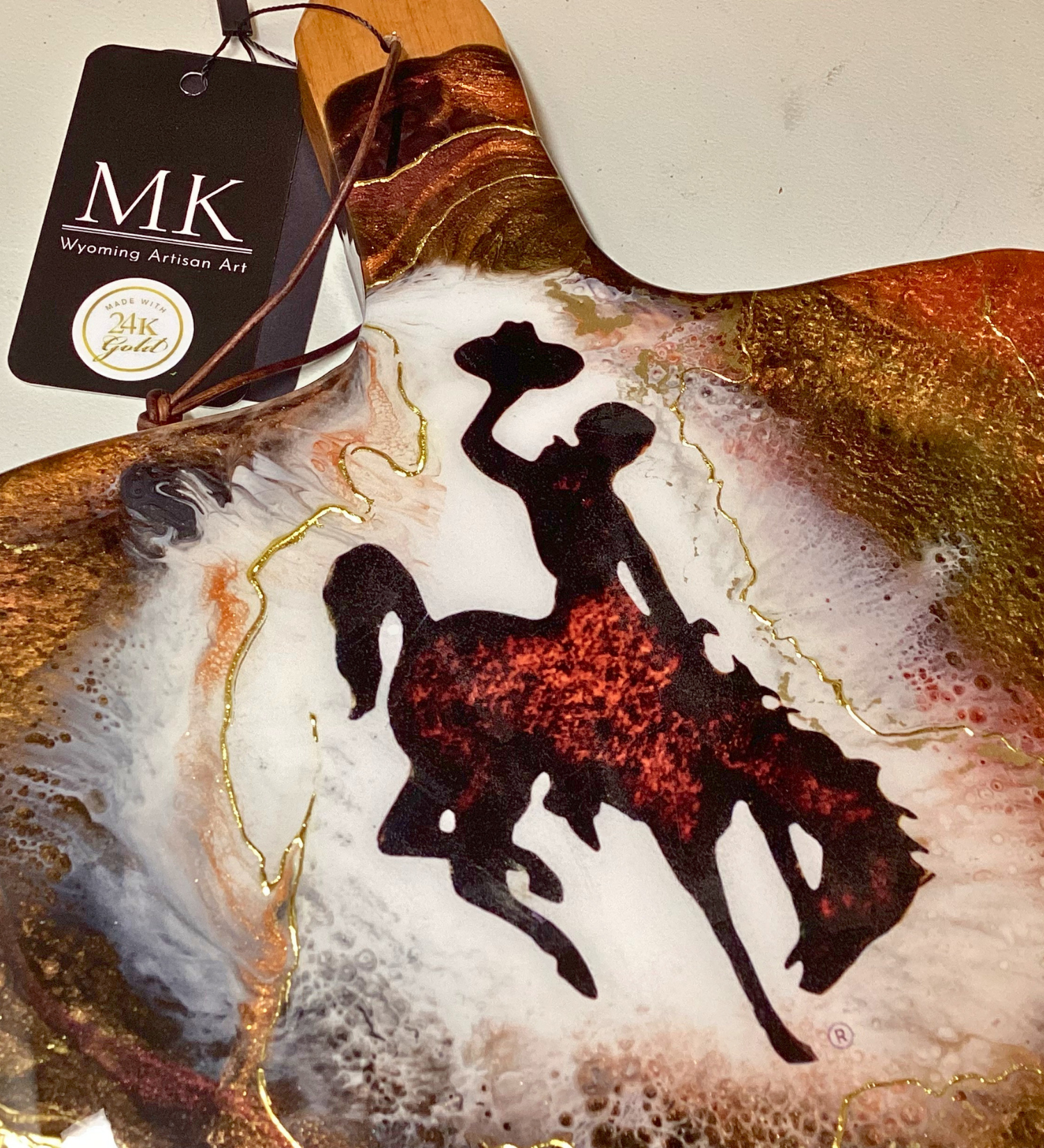 Handmade Wyoming Cowboy charcuterie board with resin art and 24K gold accents. A one-of-a-kind serving piece that doubles as Western wall art.