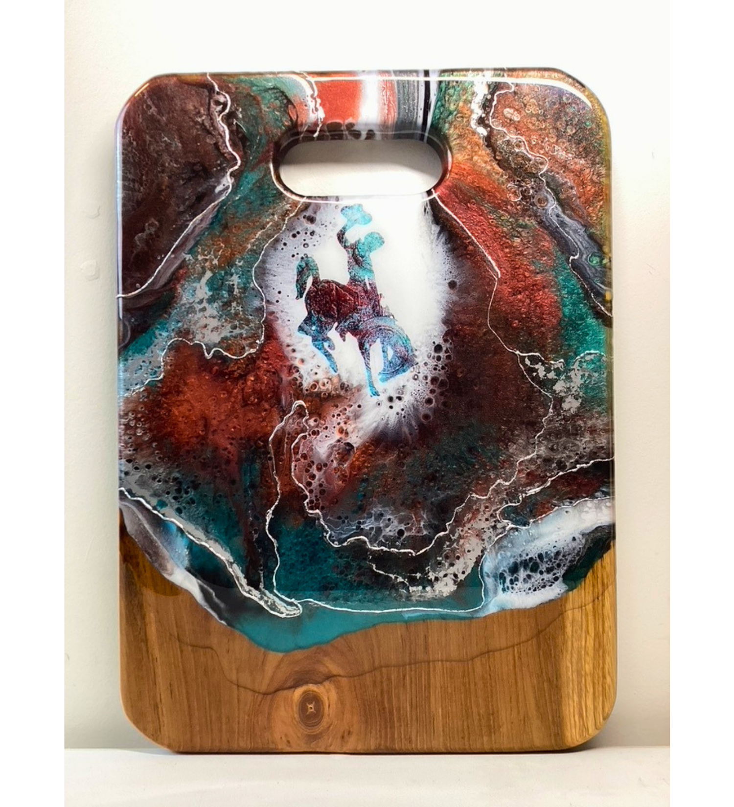 Handmade teak charcuterie board with Wyoming Cowboy design, copper and teal resin artwork, and 24K gold accents